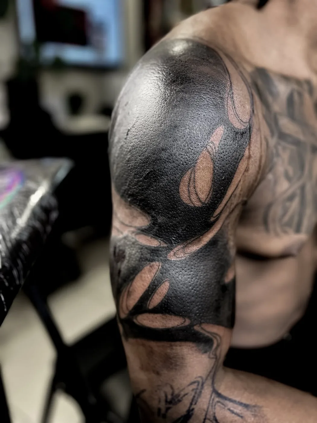 Dense blackwork tattoo by Cash